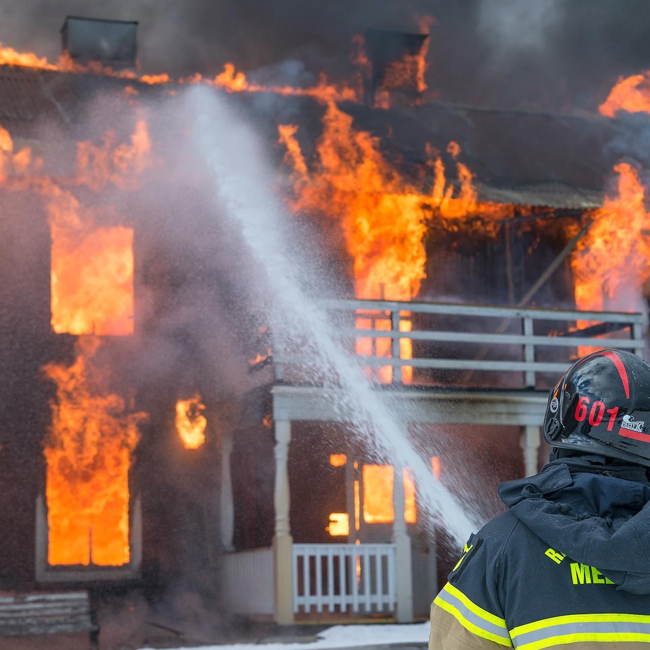 fireman watering fire